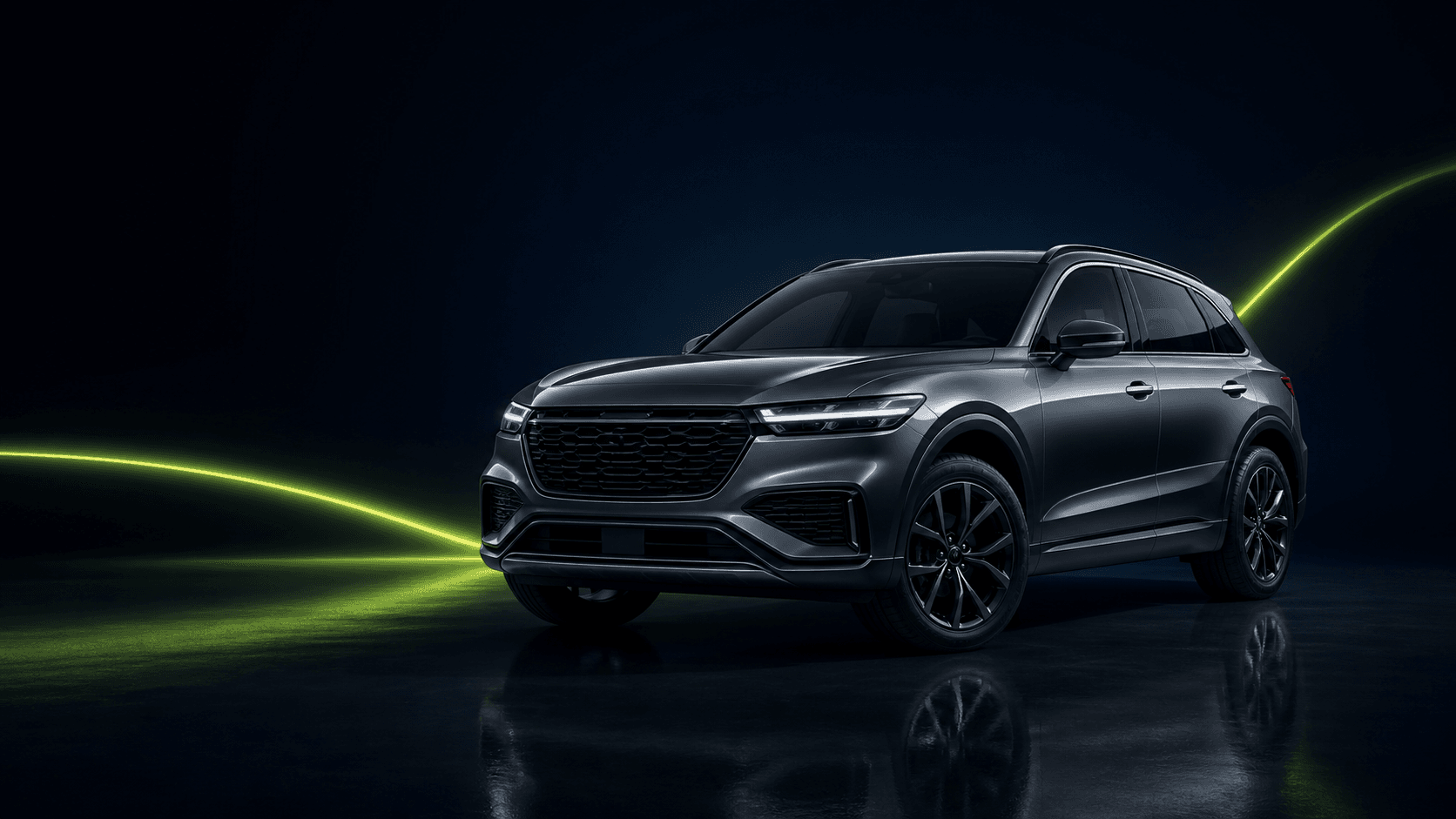 Graphite crossover vehicle in a dark studio
